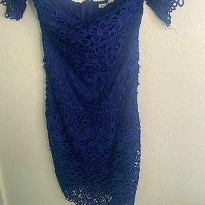 Form fitting blue lace off the shoulder dress.